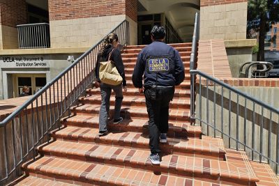 CSO officer walking with student